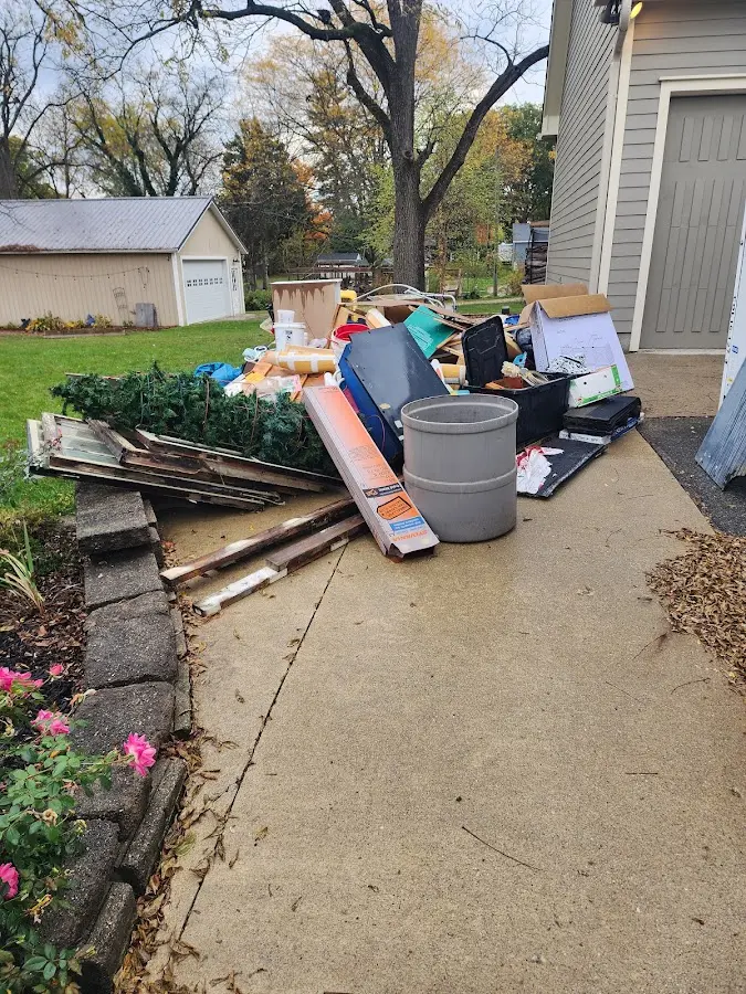 Dumpster being loaded with debris for 3 Yard Dumpster Rental in Randleman